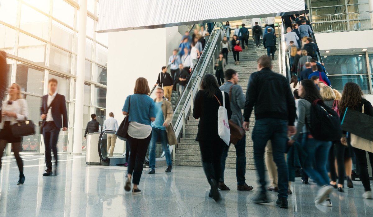 Attendees walking at trade show