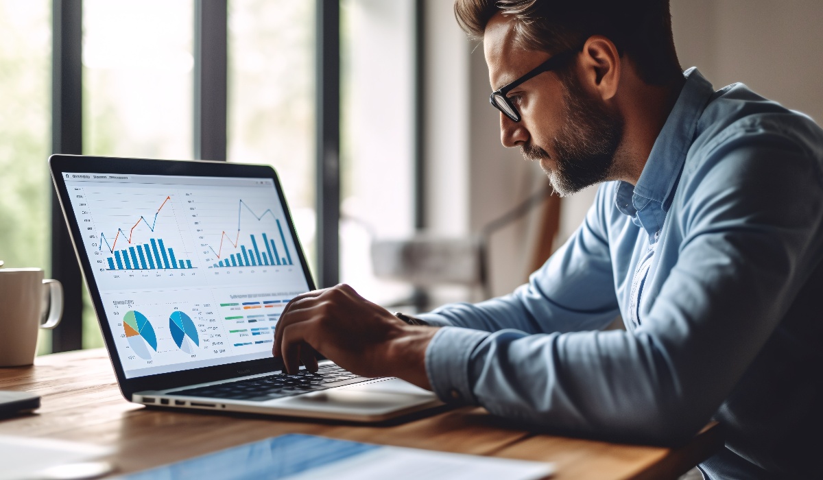 Entrepreneur reviewing charts on laptop