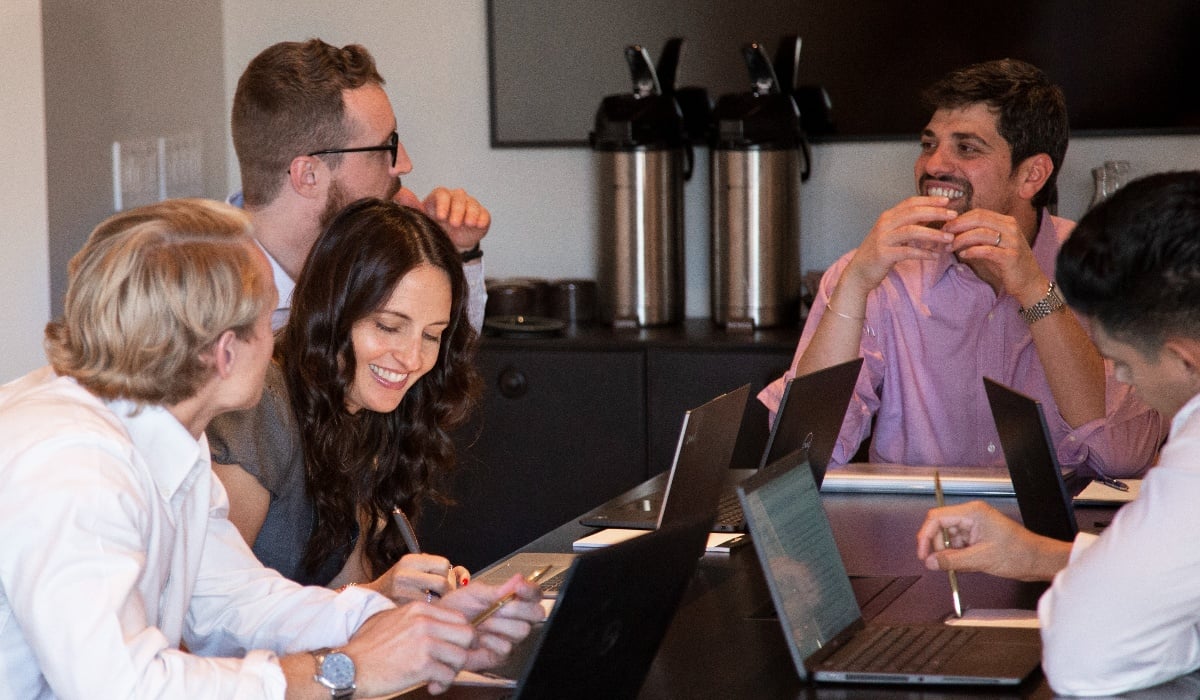 The PetroCal Team working at a table