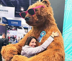 trade-show-dorielle-hugging-golden-bear