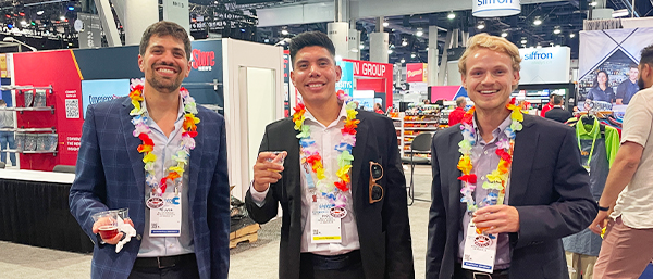 trade-show-petrocal-team-wearing-leis